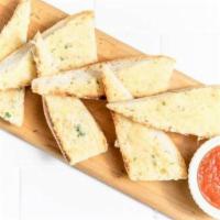 Parmesan Bread · Rustic baguette toasted with herb-garlic butter and parmesan. Served with a side of marinara...