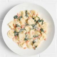 Tortellini Gorgonzola · Three-cheese tortellini, creamy gorgonzola sauce, diced fresh tomato and spinach, parmesan.