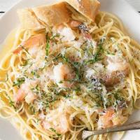 Linguini With Shrimp Scampi · Light and flavorful with a zesty kick of lemon. Tender shrimp sautéed with butter, garlic, l...