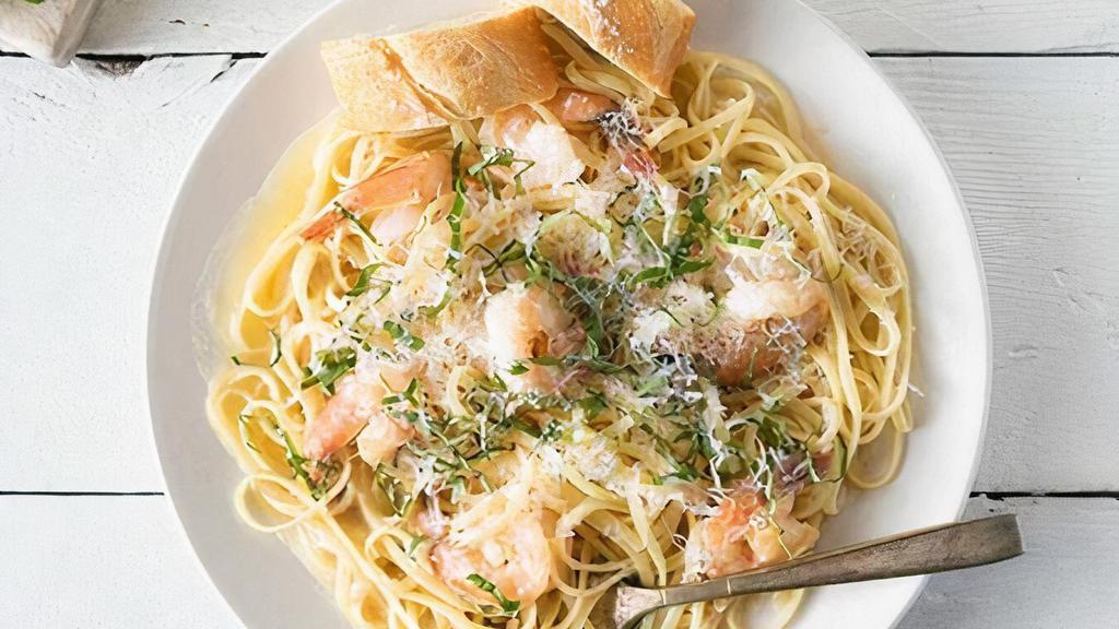 Linguini With Shrimp Scampi · Light and flavorful with a zesty kick of lemon. Tender shrimp sautéed with butter, garlic, lemon and sherry, finished with fresh organic basil and parmesan.