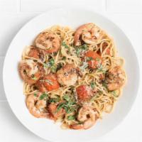 Spaghetti Con Gamberetti · Spicy shrimp tossed with grilled tomatoes, fresh mozzarella, garlic, basil, oregano, and chi...