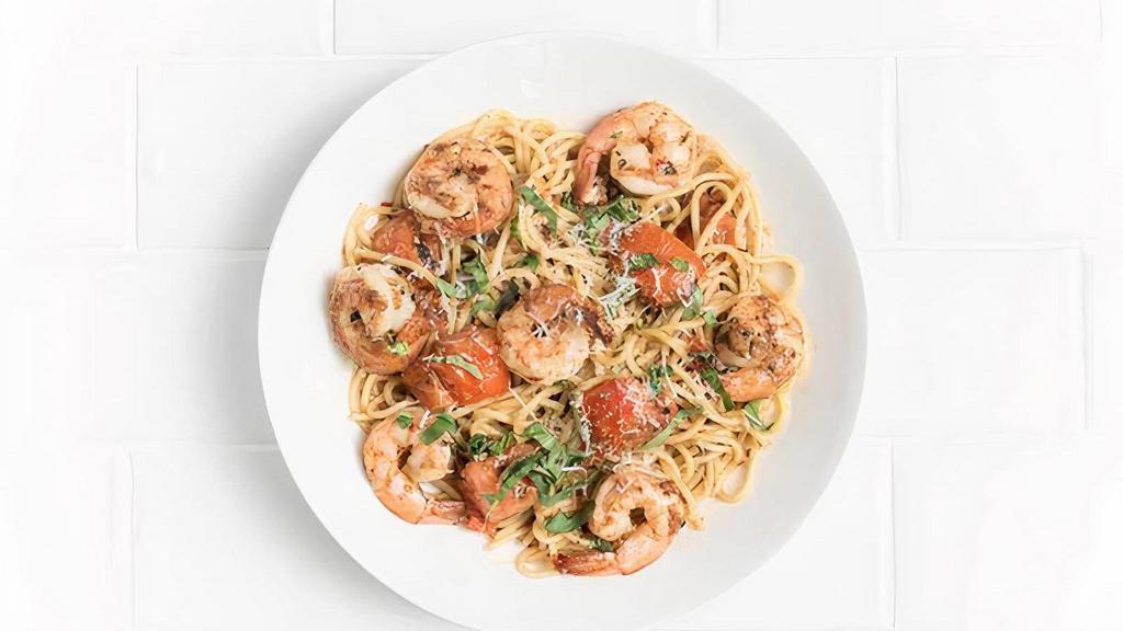Spaghetti Con Gamberetti · Spicy shrimp tossed with grilled tomatoes, fresh mozzarella, garlic, basil, oregano, and chilli flakes.