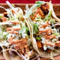 Calamari Taco · battered and fried calamari steak strips served with cabbage slaw, onions, chipotle sauce, c...