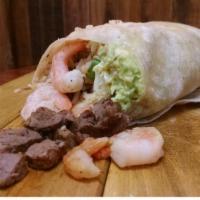Surf N' Turf Burrito - Regular Price · High quality steak
Grilled shrimp
Jumbo flour tortilla
Guacamole
Cheese
Pico de gallo