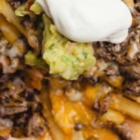 Papas Fries - Regular Price · Fries topped with choice of meat
Guacamole 
Pico de gallo
Mexican cheese