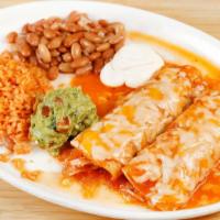 Enchiladas · Shredded chicken or beef rolled in corn tortilla. Served with melted cheese, rice, beans, le...