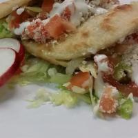 Gorditas · Two fried thick tortilla filled with lettuce, tomatoes, onion, cilantro, sour cream, and you...