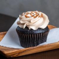 Salted Caramel · Chocolate cake with caramel buttercream frosting, drizzled with caramel and sprinkled with s...
