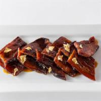 Billionaire'S Bacon · thick slab bacon / applewood smoked / yuzu glaze / honey / brown-sugar chili rub / 24k gold ...