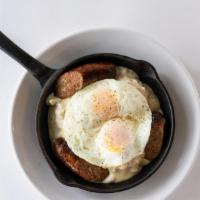 Biscuits & Gravy · Three buttermilk biscuits, country sausage gravy, grilled Italian sausage, topped with two e...