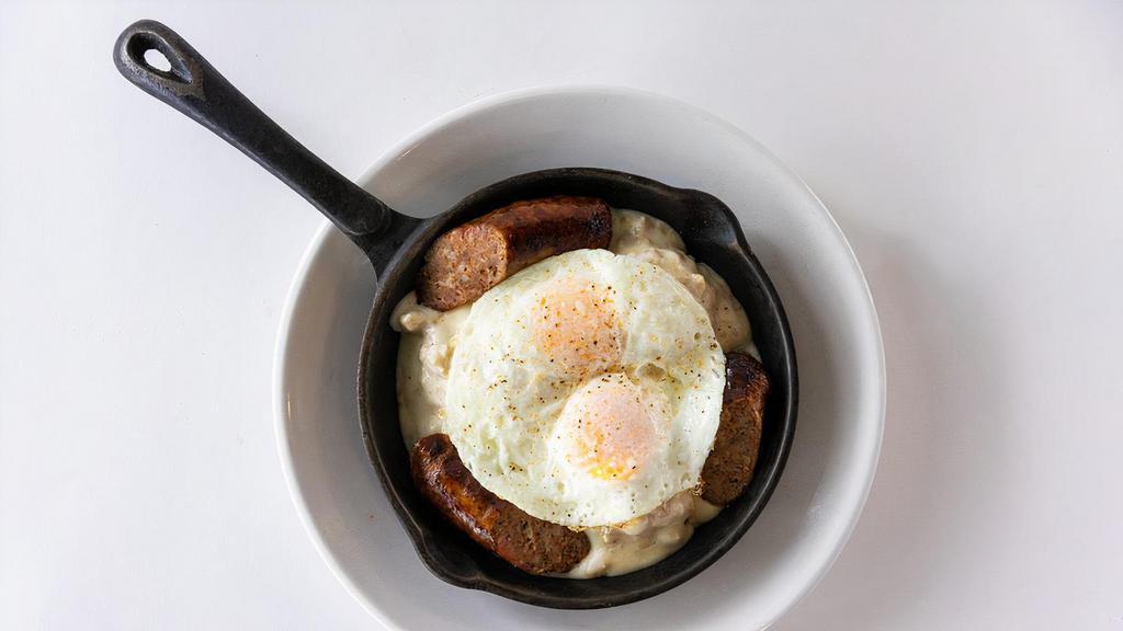 Biscuits & Gravy · Three buttermilk biscuits, country sausage gravy, grilled Italian sausage, topped with two eggs.