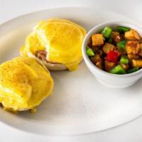 Melina'S Benedict · Two buttermilk biscuits, topped with two poached eggs, hollandaise, served with hash potatoe...