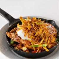 Herb Fried Chicken Hash · Tossed with crispy hash potatoes, herb fried chicken, two poached eggs, fried leeks, warm ma...