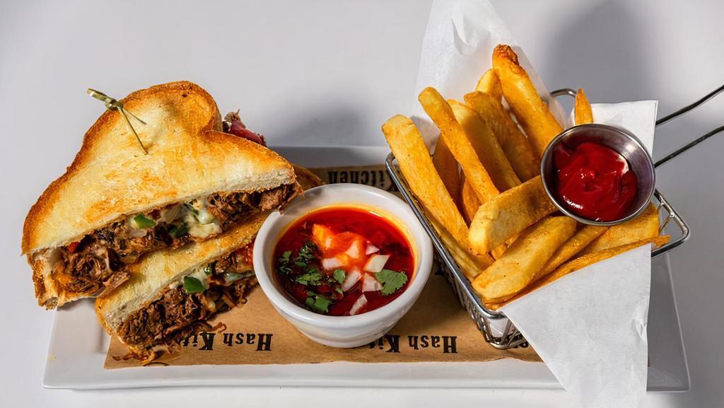 The Best F#*%Ing Birria Sandwich · Texas toast / slow chili braised beef / mozzarella /
sautéed peppers and onions / consummé