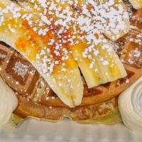 Golden Nana Waffle · bruleed banana, caramel sauce, whipped cream.