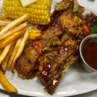 Memphis Style Bbq Ribs · Seasoned with a memphis style rub covered with bell peppers, onions, mild jalapeños & serran...