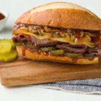 Smokehouse Brisket Sandwich · Brisket, Red Onion, BBQ Sauce & Pickles.
