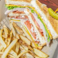 Club · Layers of delicious black peppered turkey, honey ham, applewood bacon, lettuce, tomato, and ...