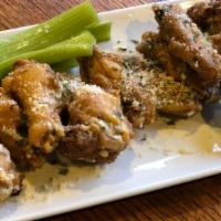 Parmesan Garlic Wings · Served with ranch and celery sticks.