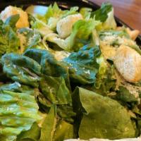 Caesar Salad · Hearts of romaine, fresh croutons, and our classic dressing. 

Dressing served on the side.