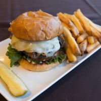 Wagyu Burger · Wagyu beef, white cheddar, caramelized onion, 13 Coins burger sauce, brioche. Served with fr...