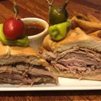 Prime Rib Dip · Thinly sliced prime rib on toasted French bread. Served with au jus, creamy horseradish, and...