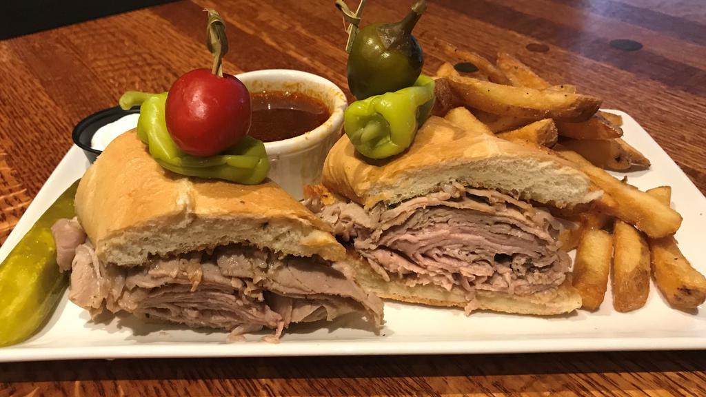 Prime Rib Dip · Thinly sliced prime rib on toasted French bread. Served with au jus, creamy horseradish, and fries.