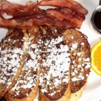 13 Coins French Toast · Thick French bread dipped in cinnamon batter, served with bacon and maple syrup.