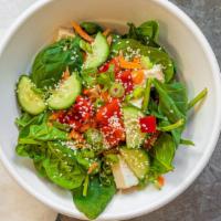Veggie Jackson · Spinach, tofu, avocado, carrots, scallions, cucumber, red peppers, and sesame seeds.