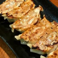 Homemade Gyoza · Handmade pan-fried pork and vegetable dumplings.