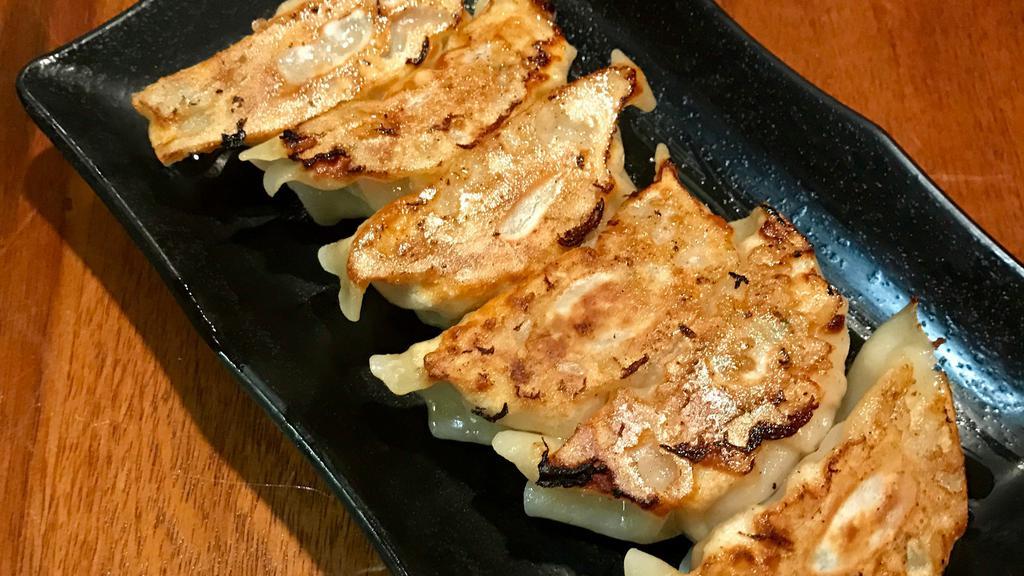 Homemade Gyoza · Handmade pan-fried pork and vegetable dumplings.