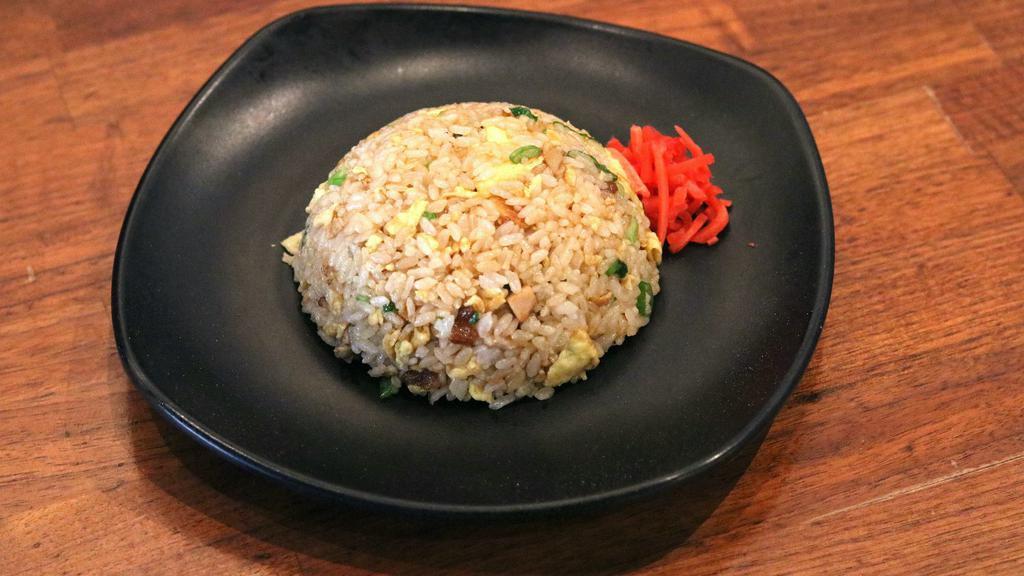 Fried Rice · Onions, green onions, egg, chopped chashu pork with rice.