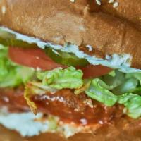 Red & Bleu · Buffalo sauce, bleu cheese spread, pickles, shredded lettuce, and tomato.