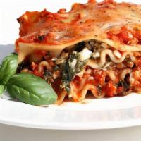 Meat Lasagna · House made meat lasagna with salad or roll.
