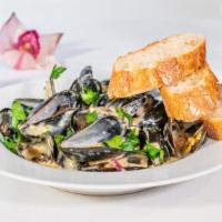 French Mussels · Steamed with onions, garlic, and fresh herbs in a creamy white wine sauce. Served with fresh...