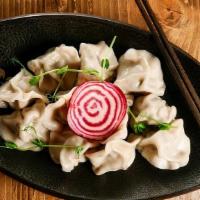 Dumplings · Small (traditionally crescent-shaped) pasta cases, stuffed with seasoned meat and served wit...