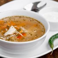 Zeama · Traditional soup with homemade noodles. Served with sour cream, fresh-baked baguette, and ho...