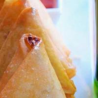 Burmese Gold Samosas (Vegan) · Crispy triangles filled with delicious stuffing made of potatoes, carrots and peas. Sizzled ...