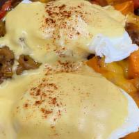 Hoodoo Hash · Golden brown sweet potatoes with brisket, caramelized onions, roasted red peppers, cheddar c...