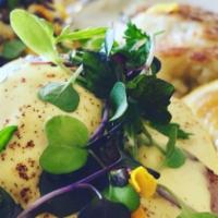Traditional Benny · English muffin grilled golden brown. Topped with ham steak poached eggs, microgreens and egg...