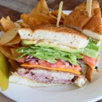 Pile Up Sandwich · Piled high oven roasted turkey, ham, applewood smoked bacon, avocado, cheddar cheese, onions...