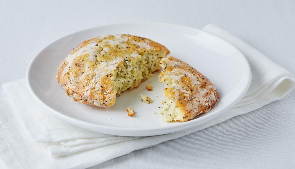 Lemon Poppy Seed Muffin Top · This Muffin Top has just the right touch of lemon. Baked with fresh lemon juice, lemon extract and poppy seeds. Lemon sugar glaze and more poppy seeds top this moist citrus treat.