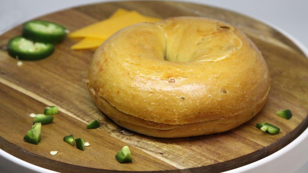 Jalapeño Cheddar Bagel · A premium bagel baked with freshly shredded natural cheddar and fresh jalapeno peppers ~ Just the right zing!