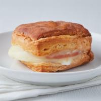 Canadian Bacon, Egg & Provolone Cheese On A Croissant · Farm-fresh egg, Hormel Canadian bacon and Tillamook provolone cheese on a fresh buttery croi...