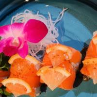 Salmon Lover Roll* · Spicy salmon and cucumber topped with salmon, lemon, and soy mustard sauce.