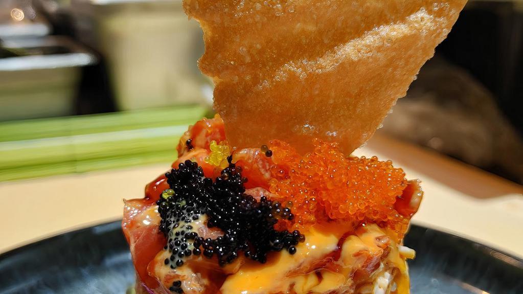 Hana Tower* · Cubed spicy tuna, crab salad, avocado, and rice layered into a tower, topped with nori and scallions.