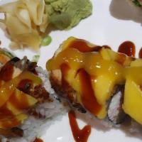 Mango Dragon Roll* · Shrimp tempura roll topped with mango, unagi, sweet soy glaze, tobiko, and mango sauce.