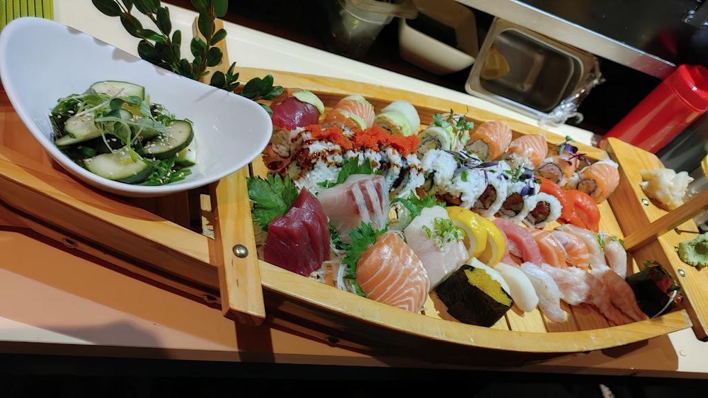 Sushi Boat B* · 4 rolls (spicy tuna, Oregon, spider, and rainbow), chef’s selection of 16pc nigiri sushi, and 12pc sashimi. For 3-4 people.