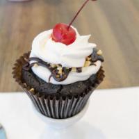Hot Fudge Sundae Cupcake · Chocolate cake with our signature buttercream frosting, peanuts, whipped topping, hot fudge ...