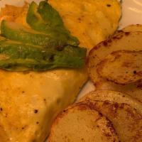 Omelet · Vegan egg, filled with cheese, onions, tomato, red peppers, spinach, topped with sliced avoc...